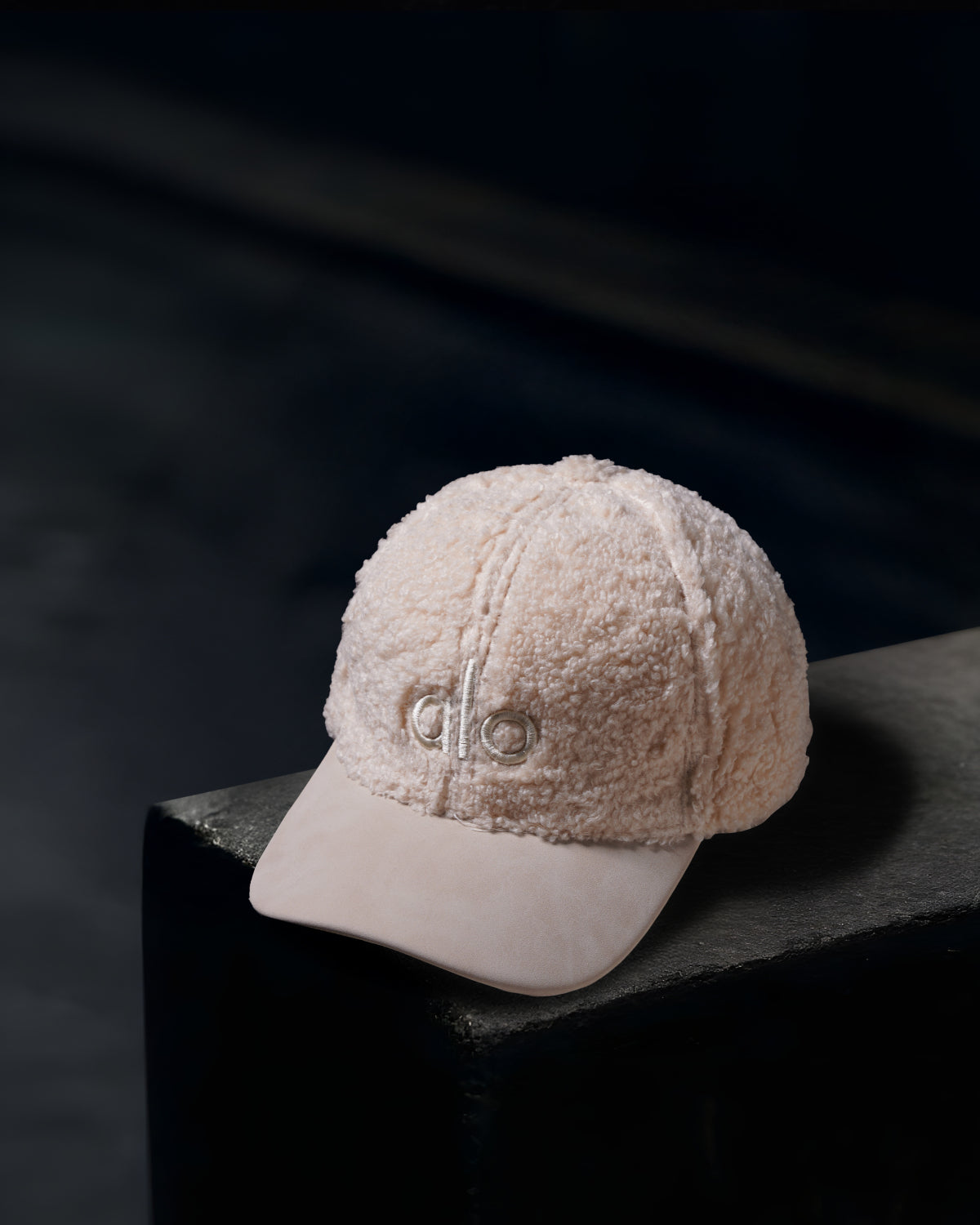 “Alo” off-white textured cap.