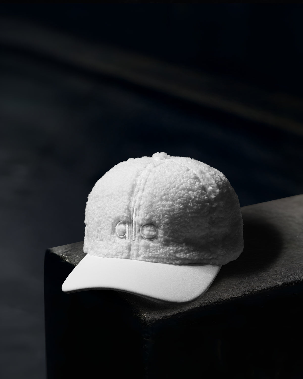 “Alo” white textured cap.