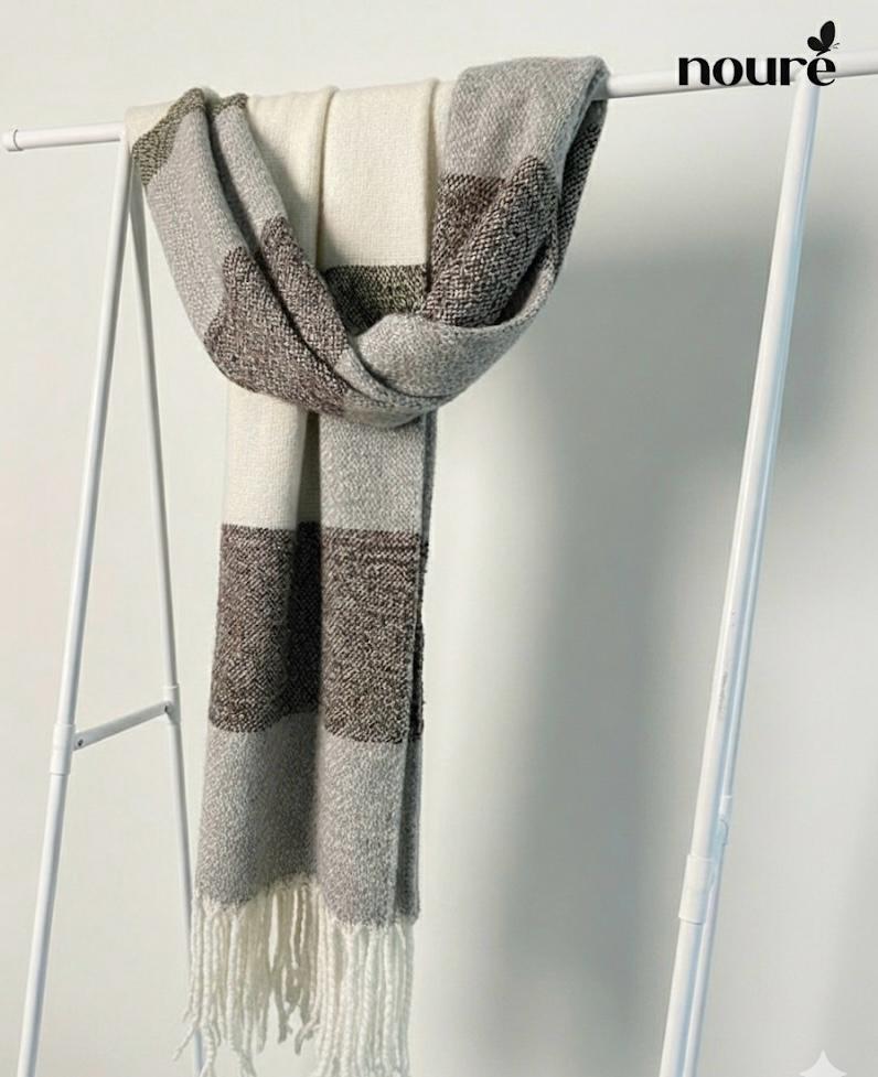 Blocked scarf in a neutral palette of off-white, light gray, and textured dark brown