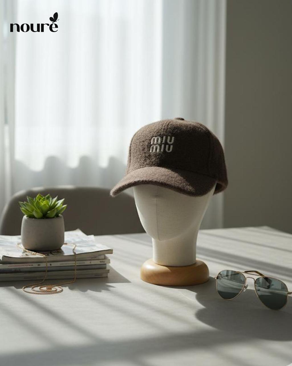 “MIU MIU” dark brown textured cap.